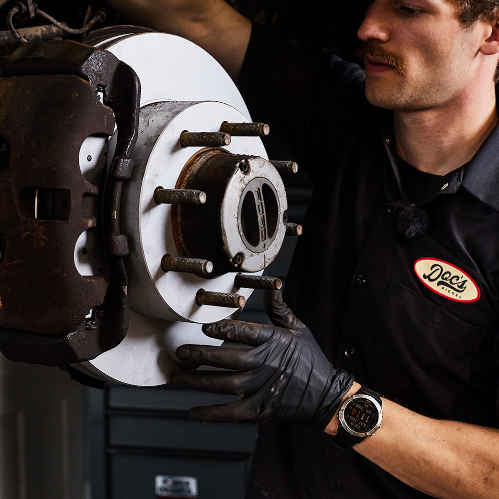 Doc's Diesel High Carbon Brake Rotors being placed on to a car lifestyle