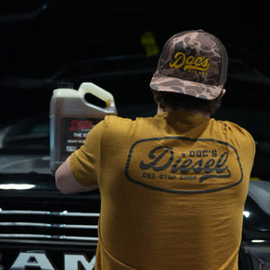 Doc's Diesel Shop Duck Brown T-Shirt on a mechanic